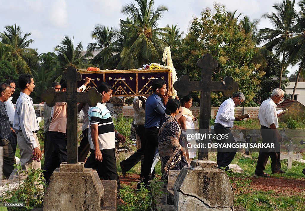 Relatives and mourners carry the coffin