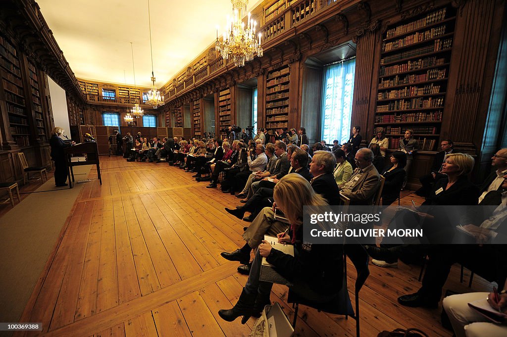 Journalists  attend a  briefing regardin