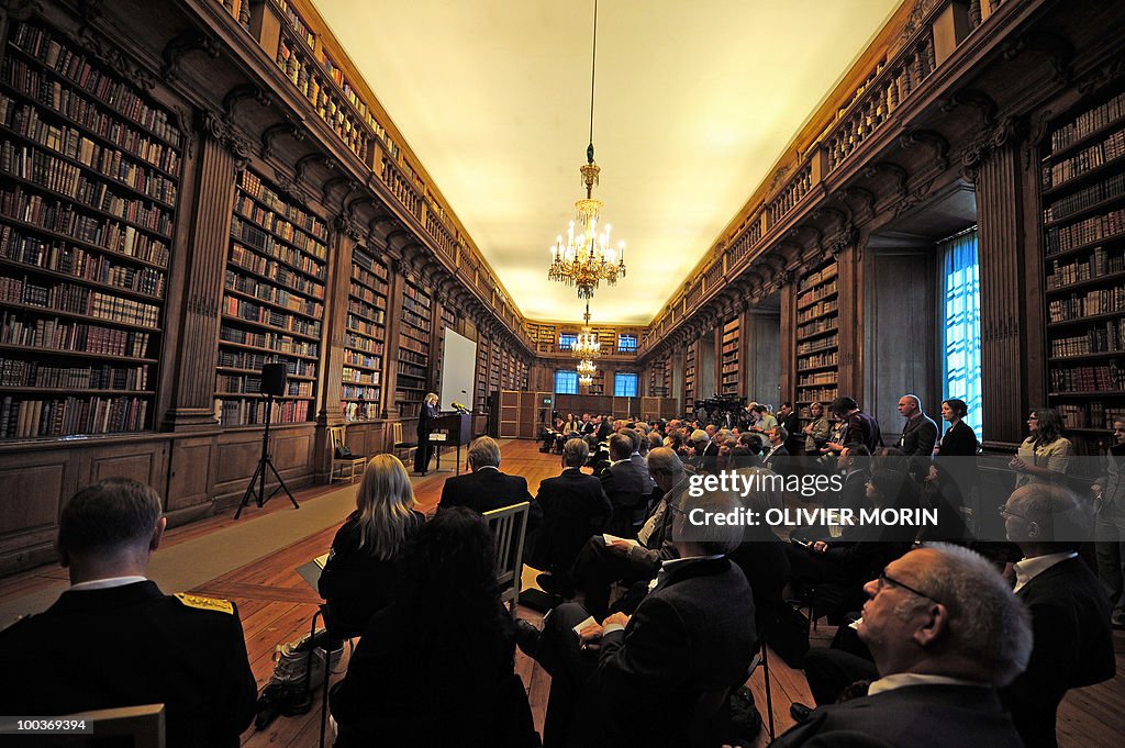 Journalists  attend a  briefing regardin