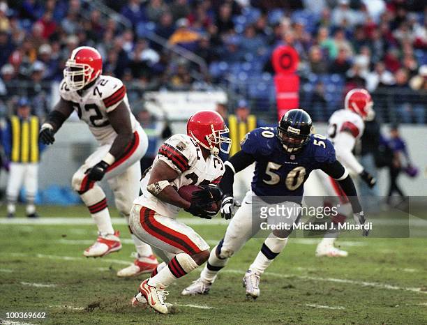 Running Back Jamel White of the Cleveland Browns runs for yardage until he was tackled by Linebacker Brad Jackson of the Baltimore Ravens at PSINet...