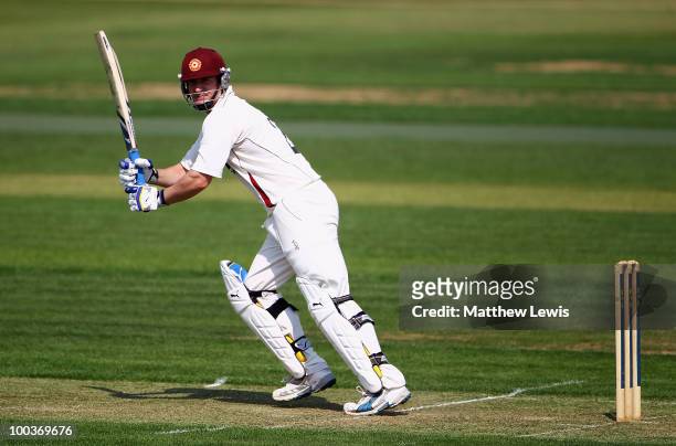 Mal Loye of Northamptonshire edges the ball away towards the boundary during the LV County Championship match between Northamptonshire and Surrey at...