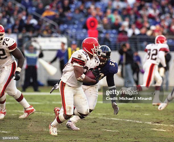 Running Back Jamel White of the Cleveland Browns runs for yardage until he was tackled by Linebacker Brad Jackson of the Baltimore Ravens at PSINet...