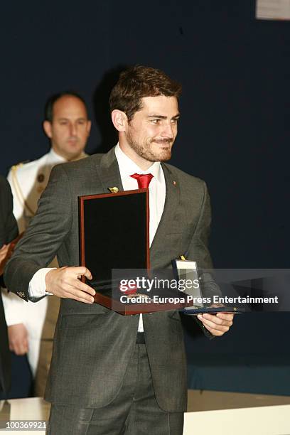 Iker Casillas receives de Golden Medal from Spanish Prince Felipe during the opening of the Spanish Football Federation Museum on May 24, 2010 in...