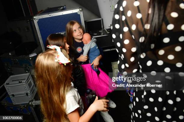 Kids models are seen backstage ahead the Kids Fashion show during Platform Fashion July 2018 at Areal Boehler on July 22, 2018 in Duesseldorf,...