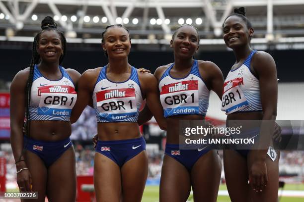 Britain's Asha Philip, Britain's Imani-Lara Lansiquot, Britain's Bianca Williams and Britain's Daryll Neita pose after winning the Women's 4x100m...
