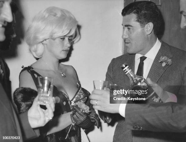 American actress Jayne Mansfield with her husband Mickey Hargitay at a nightclub in Rome, 13th June 1962.
