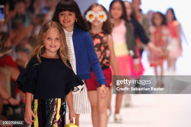 Models walk the Kids Fashion show during Platform Fashion July 2018 at Areal Boehler on July 22, 2018 in Duesseldorf, Germany.