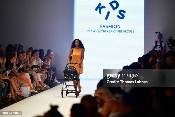 Model walks the Kids Fashion show during Platform Fashion July 2018 at Areal Boehler on July 22, 2018 in Duesseldorf, Germany.