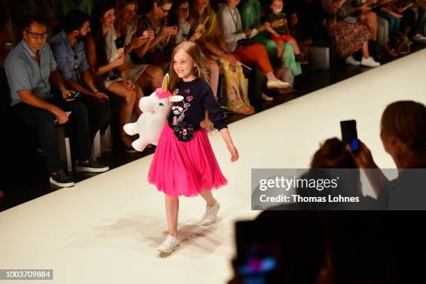 Model walks the Kids Fashion show during Platform Fashion July 2018 at Areal Boehler on July 22, 2018 in Duesseldorf, Germany.