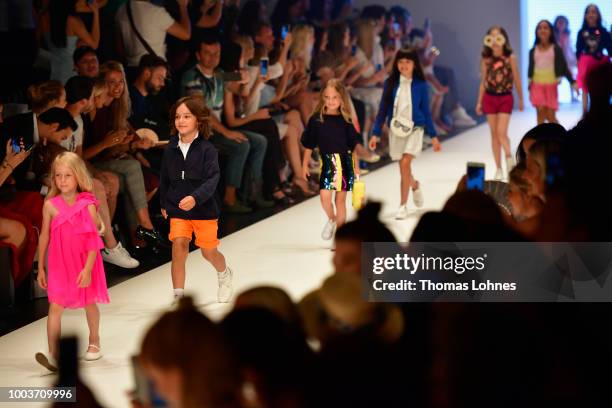 Models walk the Kids Fashion show during Platform Fashion July 2018 at Areal Boehler on July 22, 2018 in Duesseldorf, Germany.