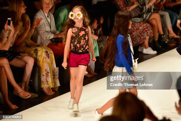 Models walk the Kids Fashion show during Platform Fashion July 2018 at Areal Boehler on July 22, 2018 in Duesseldorf, Germany.