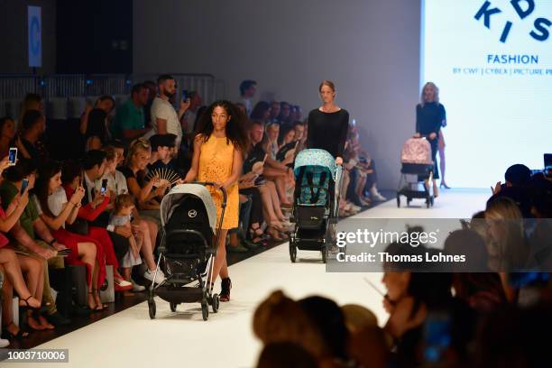 Models walk the Kids Fashion show during Platform Fashion July 2018 at Areal Boehler on July 22, 2018 in Duesseldorf, Germany.