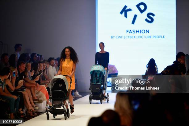 Models walk the Kids Fashion show during Platform Fashion July 2018 at Areal Boehler on July 22, 2018 in Duesseldorf, Germany.