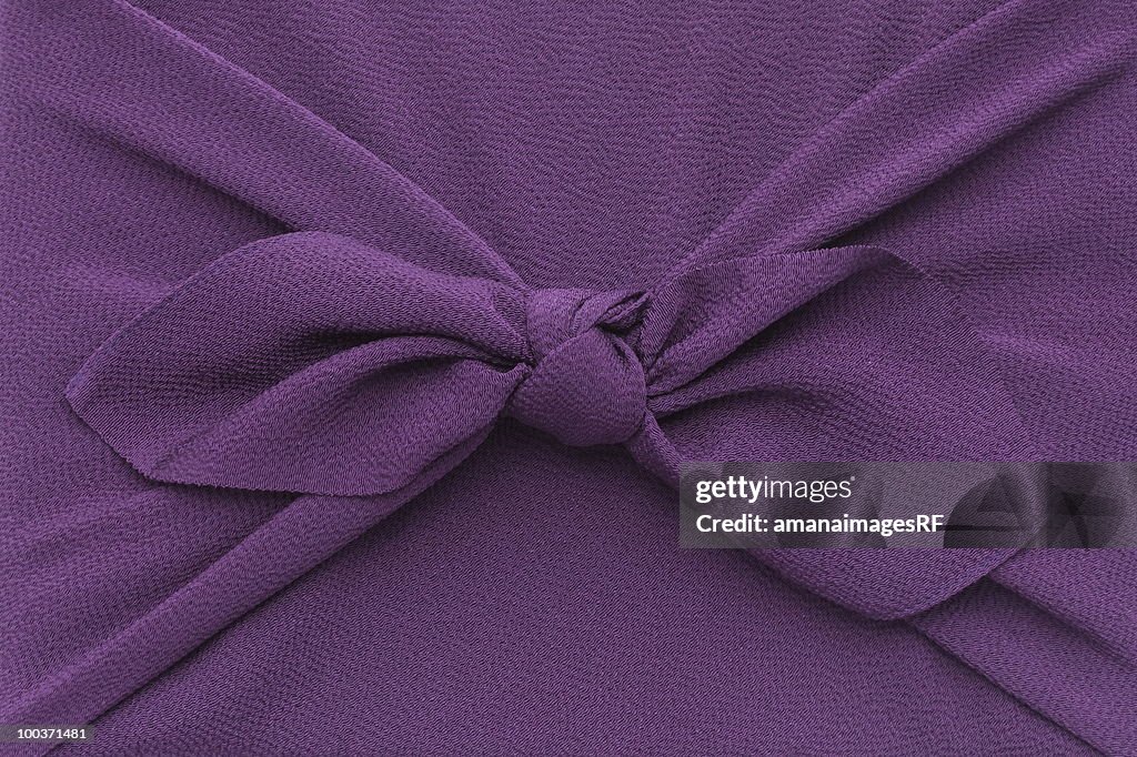 Close up of box wrapped in purple cloth, full frame