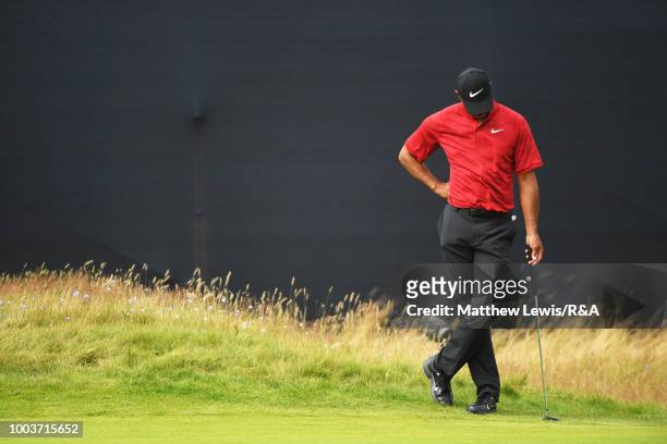 Tiger Woods of the United States looks on from the side of the 4th hole green during the final round of the Open Championship at Carnoustie Golf Club...