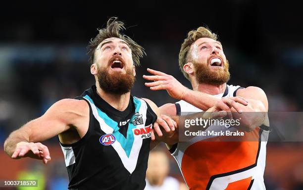 Charlie Dixon of Port Adelaide rucks against Dawson Simpson of the Giants during the round 18 AFL match between the Port Adelaide Power and the...