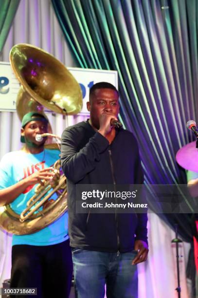 Manuel Perkins Jr. Of The Soul Rebels and The GZA perform at The Blue Note Club on July 21, 2018 in New York City.