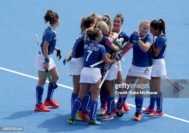 Giuliana Ruggieri of Italy celebrates scoring her side's third goal with team mates during the Pool A game between China and Italy of the FIH Womens...
