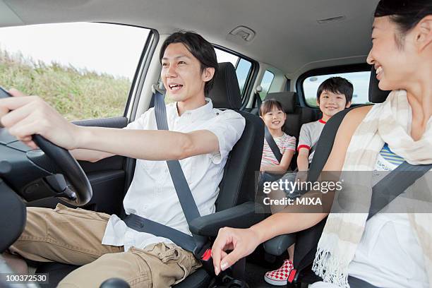 family going for a drive - four people in car fotografías e imágenes de stock