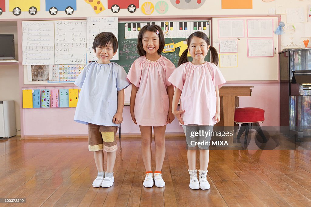 Kindergarten Children Standing at Schoolroom