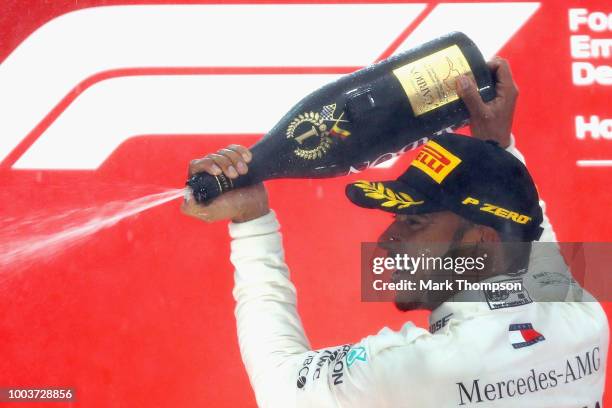 Race winner Lewis Hamilton of Great Britain and Mercedes GP celebrates on the podium during the Formula One Grand Prix of Germany at Hockenheimring...