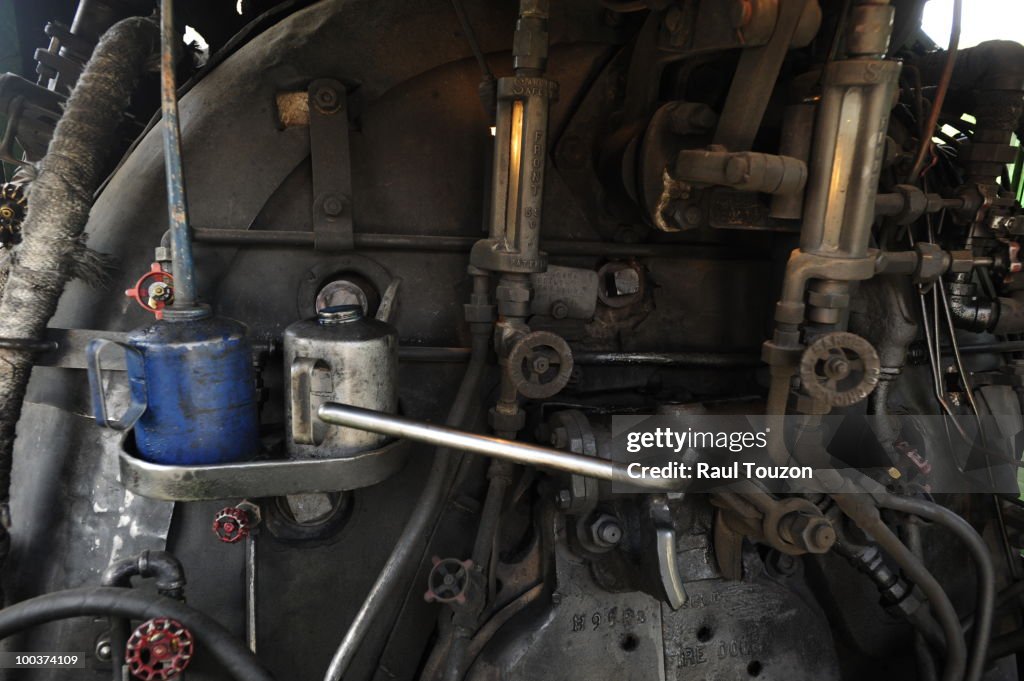 Oil dispensers on an antique locomotive.