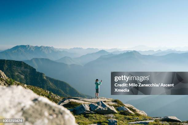 mountain ridge crest with distant hiker - wonderlust computer stock pictures, royalty-free photos & images