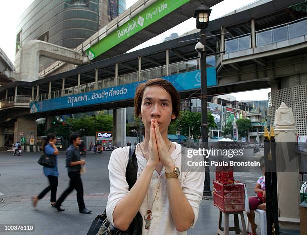 Thai woman prays at the Rachaprasong Buddhist shrine at the site of the former the redshirt camp on May 24, 2010 in Bangkok, Thailand. Bangkok is...