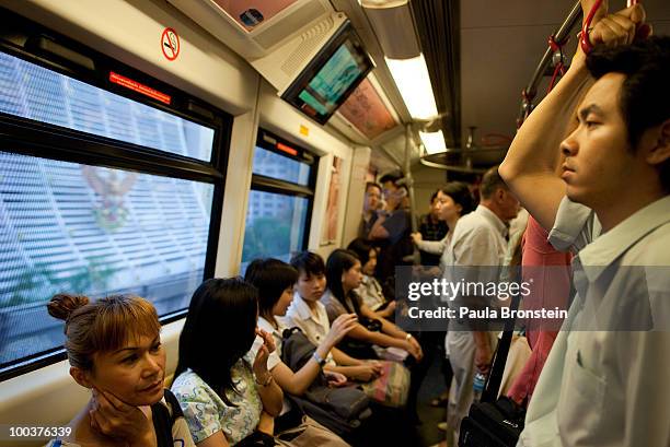 Bangkok residents head home from work on the Bangkok Sky train on May 24, 2010 in Bangkok, Thailand. Bangkok is slowly getting back to business as...