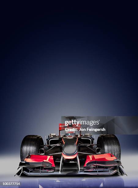 open-wheel single-seater racing car race car on blue - racing car stock pictures, royalty-free photos & images