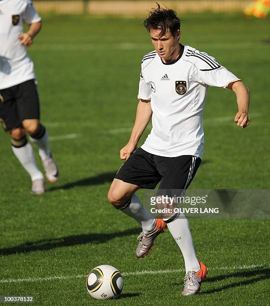 Germany's midfielder Christian Traesch controls the ball during a training match against Sued Tyrol FC at the team's training centre in Appiano, near...