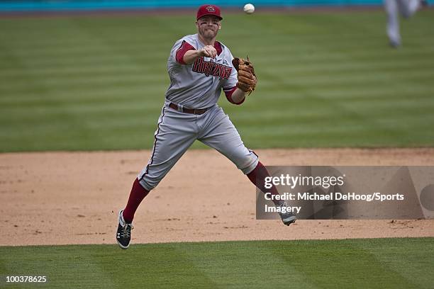 Mark Reynolds of the Arizona Diamondbacks throws to first base during a MLB game against the Florida Marlins in Sun Life Stadium on May 18, 2010 in...