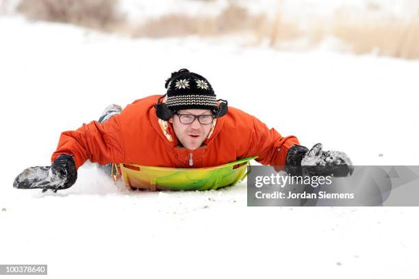 Man Riding Sled Man Sledding Photos and Premium High Res Pictures - Getty Images