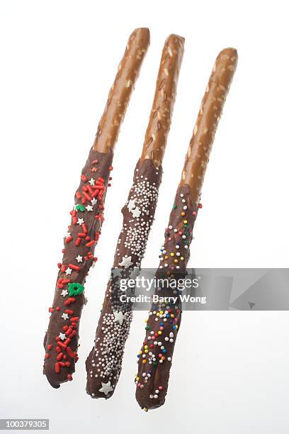 three chocolate covered pretzel sticks - chocolate dipped stock pictures, royalty-free photos & images