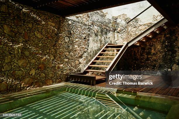 view of stairs and plunge pool at luxury spa - luxury spa stock pictures, royalty-free photos & images