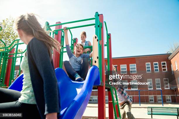 group of kids active in school playground at recess.. - school yard stock pictures, royalty-free photos & images