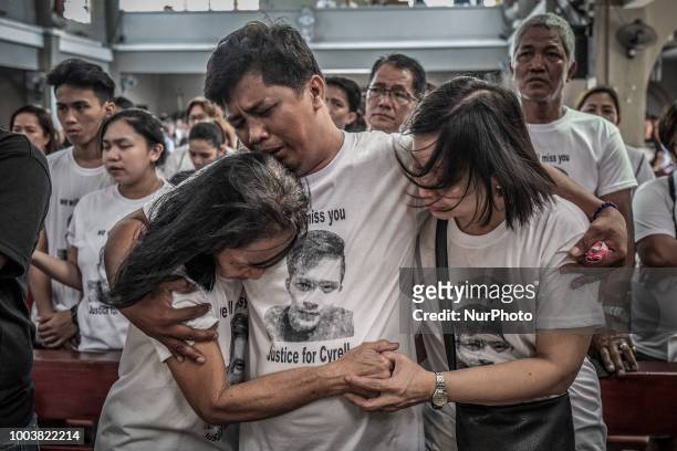 Mourners take part in the funeral of Jhan Cyrell Ignacio, a college freshman who was killed by unidentified gunmen, in Malabon, Metro Manila,...