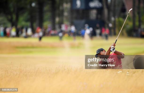 Tiger Woods of the United States hits his second shot from the rough on the tenth hole during the final round of the 147th Open Championship at...