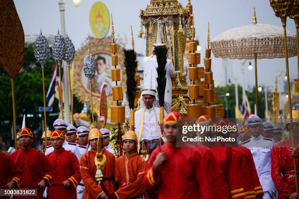 Thais parade in a procession comprising symbols of Buddhism to mark Asanha Bucha Day in Bangkok, Thailand, 22 July 2018.