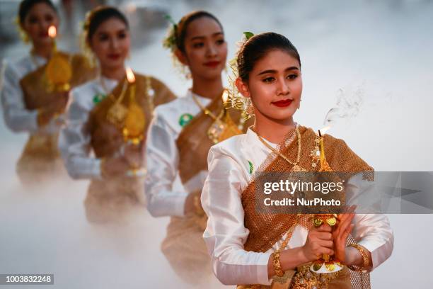 Thai dancer perform during the Buddha relics procession to mark Asanha Bucha Day in Bangkok, Thailand, 22 July 2018.