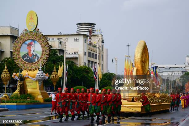 Thais parade in a procession comprising symbols of Buddhism to mark Asanha Bucha Day in Bangkok, Thailand, 22 July 2018.