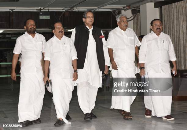 Congress MP Shashi Tharoor with party leaders Oommen Chandy , Ramesh Chennithala and others arrive for the Extended Congress Working Committee...