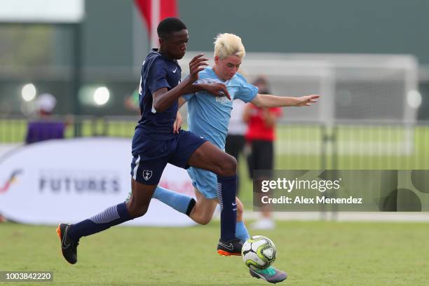 Ngoma Muanda of Tottenham Hotspur FC chases a loose ball against Brayden Copland of ICC Futures All Stars North Carolina during the International...