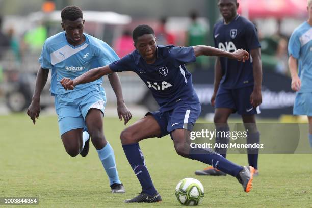 Ngoma Muanda of Tottenham Hotspur FC chases a loose ball against Chris Haggard of ICC Futures All Stars North Carolina during the International...