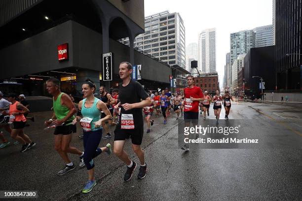 Runners compete in the 2018 Humana Rock 'n' Roll Chicago Half Marathon and 10K on July 22, 2018 in Chicago, Illinois.