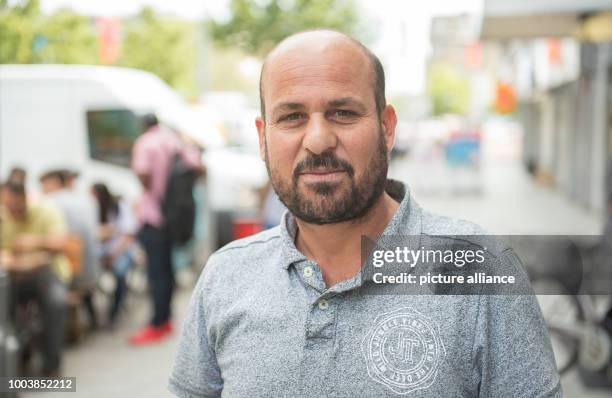 Dawed Suleiman from Iraque stands in the pedestrian zone in Hanover, Germany, 15 June 2017. Three years ago he came from Iraque to Germany and...