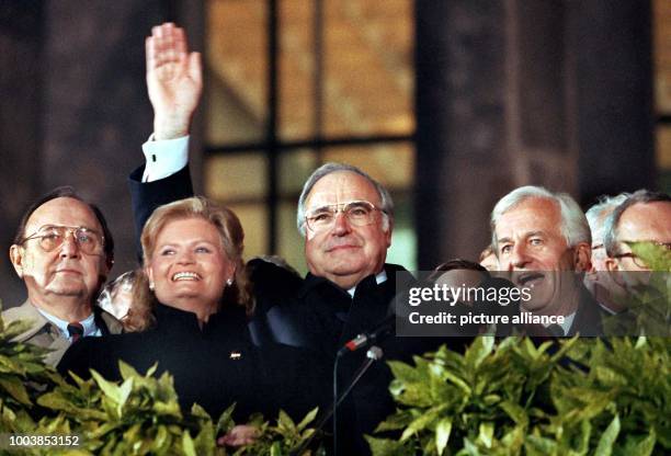 An imaged dated 3 October 1990 shows the then German foreign minister Hans-Dietrich Genscher , Hannelore Kohl, German chancellor Helmut Kohl , the...