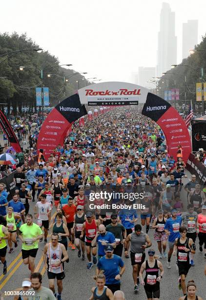 Runners in the Rock "n" Roll Chicago Half Marathon and 10K race leave the starting line on July 22, 2018 in Chicago, Illinois.