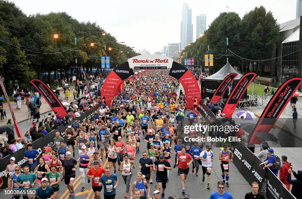 Runners in the Rock "n" Roll Chicago Half Marathon and 10K race leave the starting line on July 22, 2018 in Chicago, Illinois.