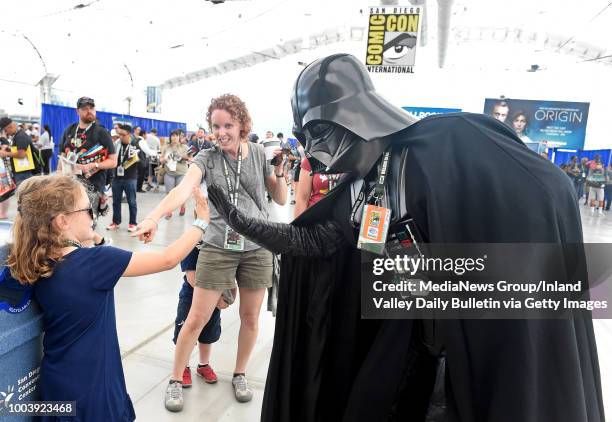 Darth Vader greets fans attending Preview Night during the San Diego Comic-Con at the San Diego Convention Center in San Diego on Wednesday, July 18,...